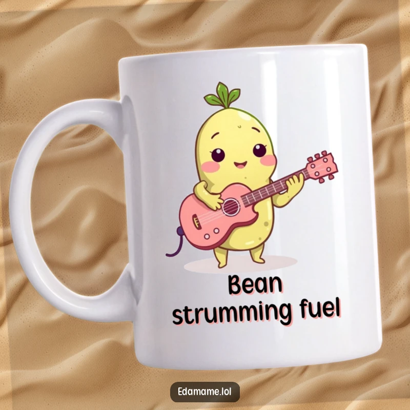 Funny mug features a green edamame bean strumming a tiny acoustic guitar, looking cool and ready to jam, with a leafy sprout.