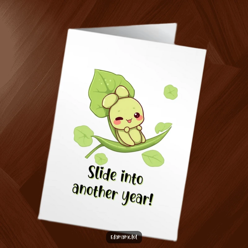 Funny Free Printable Birthday Card: Cute edamame character joyfully slides down a vibrant green leaf, bringing smiles.