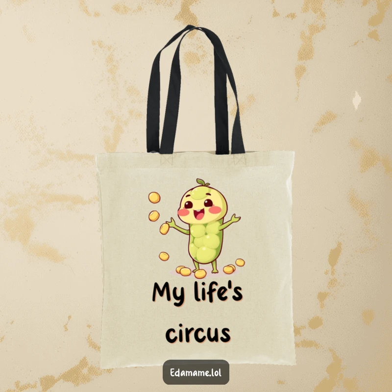 Funny tote bag featuring a happy anthropomorphic edamame pod juggling beans, perfect for shopping and daily use.